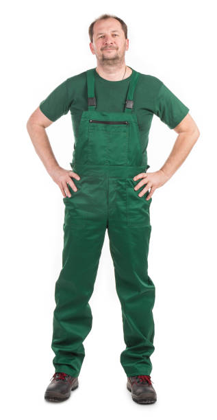 istock Worker in green overalls. 1382813823