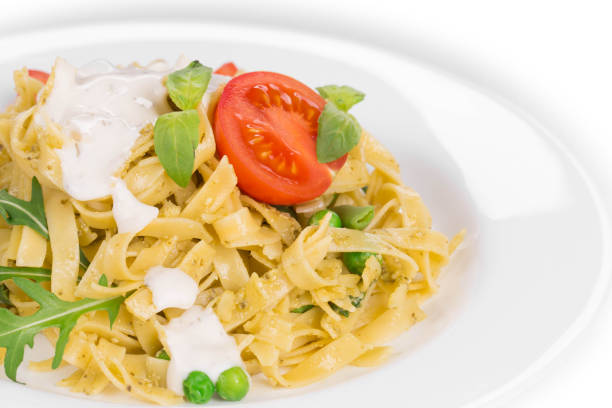 Italian pasta with tomatoes. Isolated on a white background.