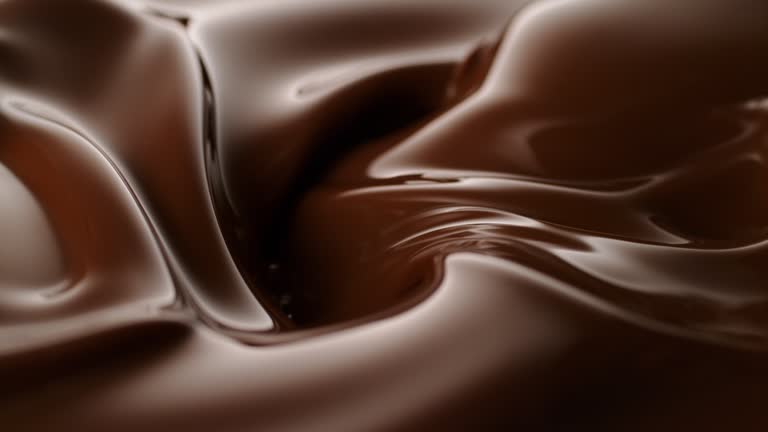 Melted chocolate flow. Shiny swirl in the middle