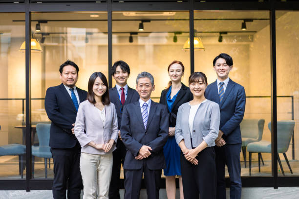 istock Business people lined up in front of the office 1382814225