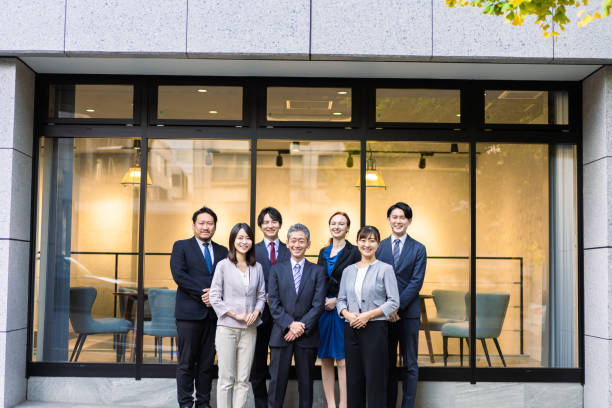 istock Business people lined up in front of the office 1382814228