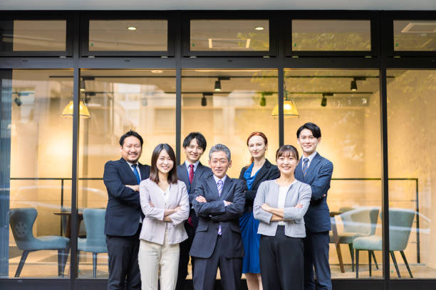 istock Business people lined up in front of the office 1382814232
