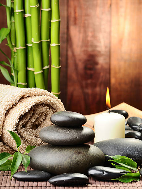 Hot stones towel bamboo and candle stock photo