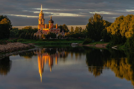 Resurrection Cathedral on the bank of the Polist River in the early cloudy summer morning, Staraya Russa, Novgorod Region, Russia