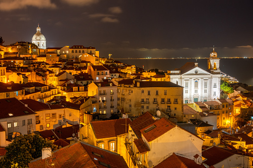 View of the historic Alfama district in Lisbon, Portugal, at night
