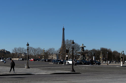 Place de la Concorde in winter with traffic and the Eiffel tower in the background in Paris, France, Europe.