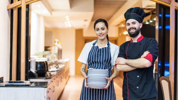 istock Professional cooks standing side by side at the restaurant 1382835848