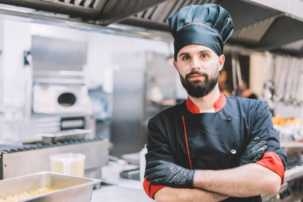 istock Portrait of confident chef standing at restaurant kitchen 1382835863