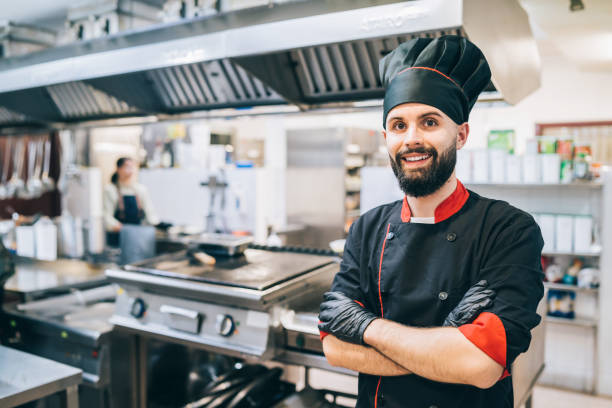 istock Portrait of confident chef standing at restaurant kitchen 1382836384