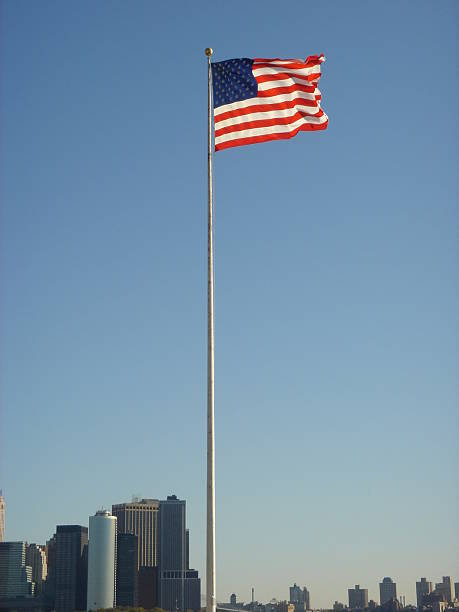 istock USA flag with buildings around 138284002