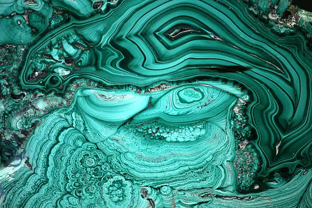 The cut of green malachite as a background