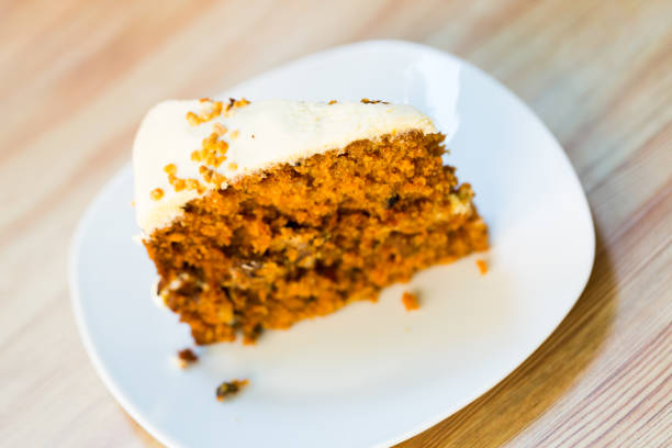 Carrot cheese cake ready for easter. Close up of carrot cheese cake square. Selective focus.