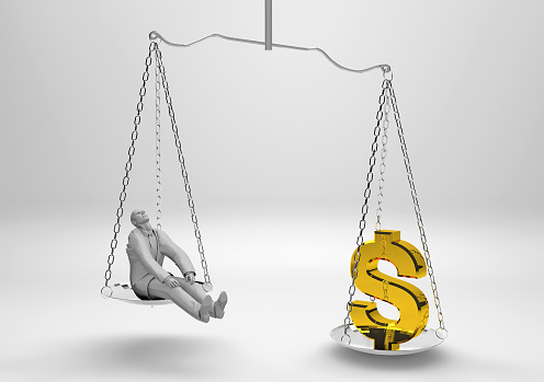 Man vs dollar value. Businessman and golden dollar symbol balancing on a scales. The business war that has escalated in recent years. The worth of a person has come to be measured in money. / You can see the animation movie of this image from my iStock video portfolio. Video number: 1372414878