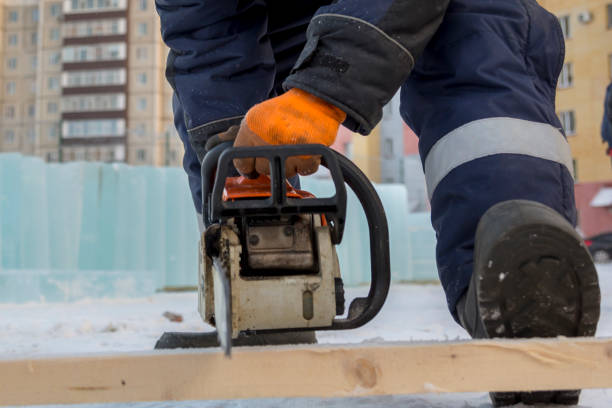 istock Fitter with a gasoline saw cuts long planks 1382883646