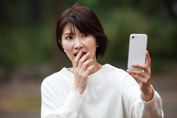 istock A woman shooting with a smartphone in a hurry 1382888161