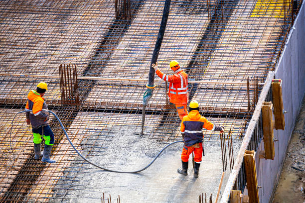 istock Concrete pouring on the construction site. 1382888692