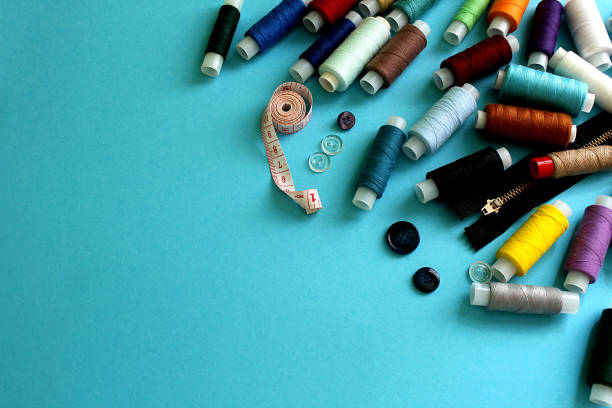 istock A lot of spools of threads scattered on the table 1382894590