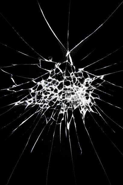 istock Cracked glass on a black background. 1382907255