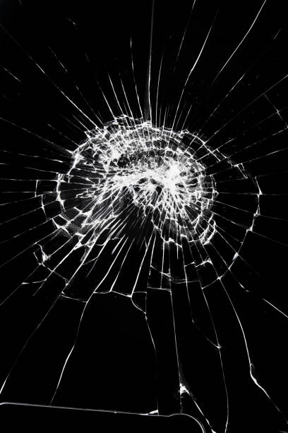 istock Texture of broken glass with cracks. Abstract cracked smartphone screen from shock. 1382907280