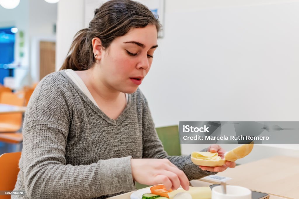 Young woman have breakfast in the coffee bar. Breakfast Stock Photo