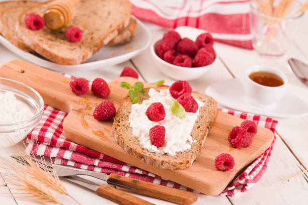 istock Rye bread with cottage cheese and raspberries. 1382912435