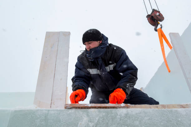 istock Assembler at the construction site with a brush in his hands 1382912614