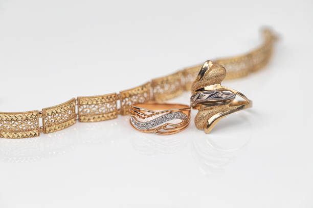 istock Engagement ring of gold and different weave chain 1382912730