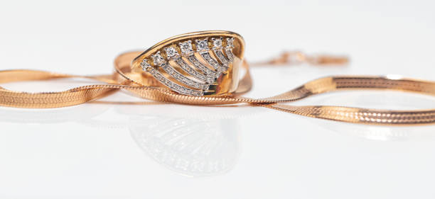istock Engagement ring of gold and different weave chain 1382912822