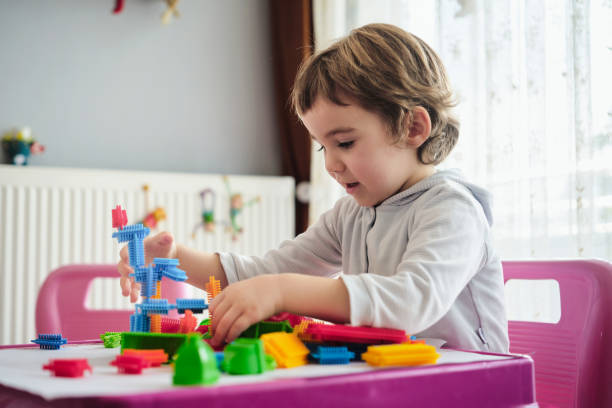 istock Child Boy Playing With Toys At Home 1382912902