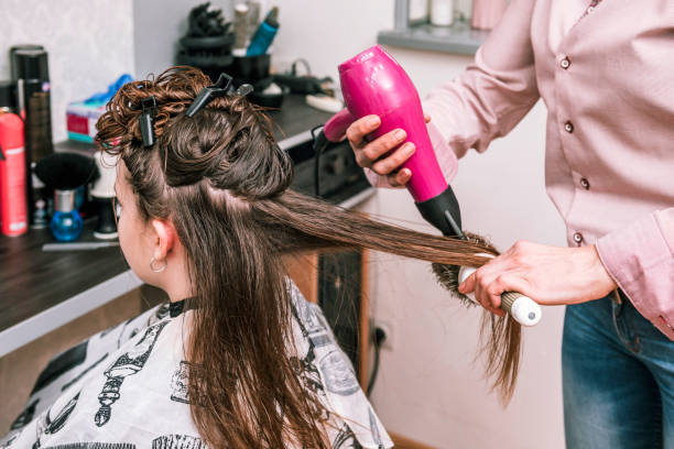 istock A girl is getting a haircut 1382913971