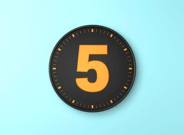 Number 5 Over Black wall clock on blue background. Time concept.