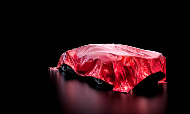 istock sport car under a red blanket that hides its characteristics. 1382915848