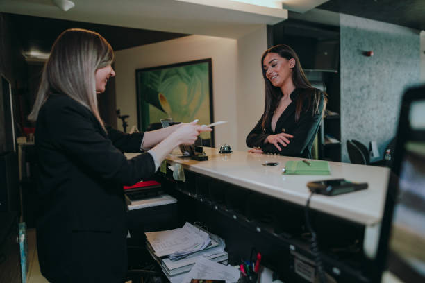 istock Businesswoman getting information at the hotel reception 1382915857