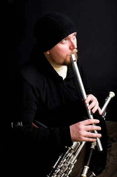 Photo of Folk musician plays a Irish whistle