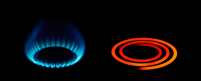 A gas and electric cooker ring on full power