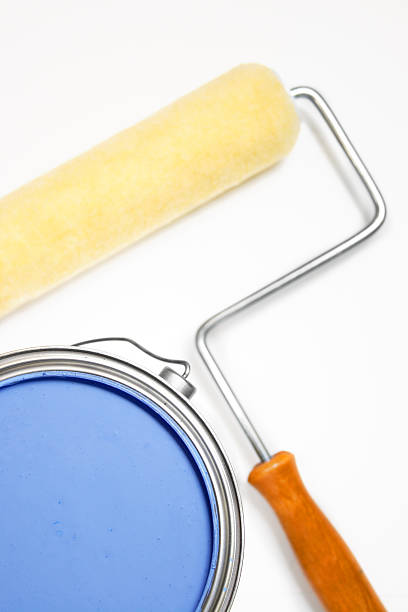 istock isolated blue can of paint with roller in background 138294287
