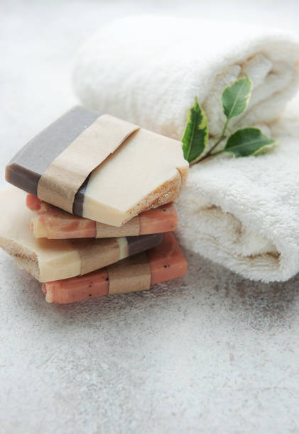 istock Handmade soap bars and green leaves 1382943902