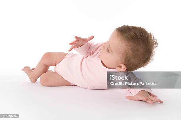 Baby Looking At Her Own Hand Stock Photo - Download Image Now - 6-11 Months, Baby - Human Age, Baby Girls