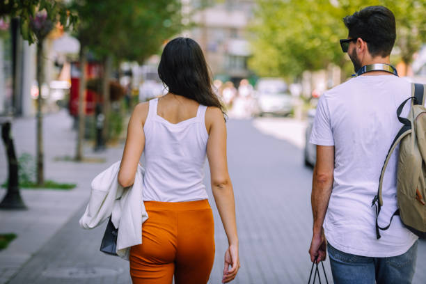 istock Romantic couple walking through downtown 1382962873