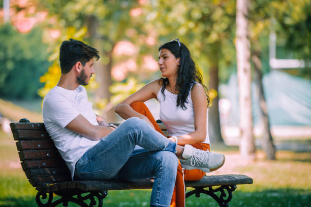 istock Happy attractive couple enjoying outdoors during sunset 1382962905