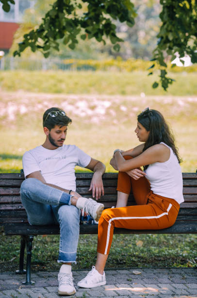 istock Happy attractive couple enjoying outdoors during sunset 1382962919