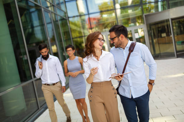 istock Business people having fun, teamwork and chatting at workplace office together. 1382980044