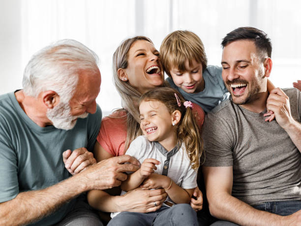 istock Playful multi-generation family having fun at home. 1382985195