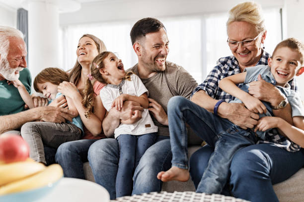 istock Cheerful extended family having fun together at home. 1382987563