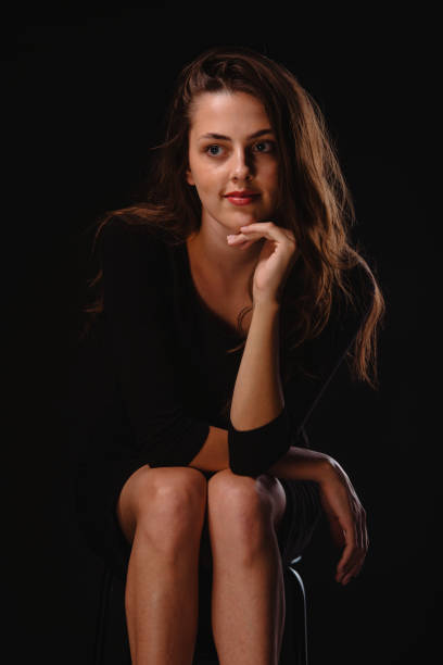 istock Sexy female model sitting on cheir 1382989667