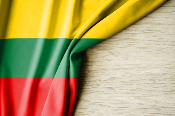 istock Lithuania flag. Fabric pattern flag of Lithuania. 3d illustration. with back space for text. 1382990288