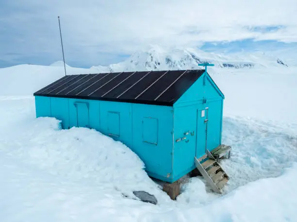 Photo of Well-preserved British scientific station standing at Damoy Point, near Port Lockroy, Palmer Archipelago, Antartctic Peninsula, Antarctica