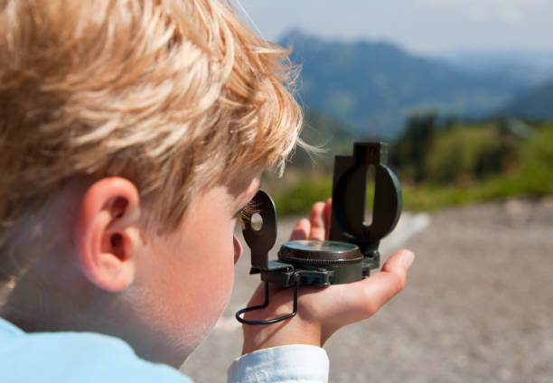 Children Using Compass 570+ Child Holding Compass Stock Photos, Pictures & Royalty-Free Images ...