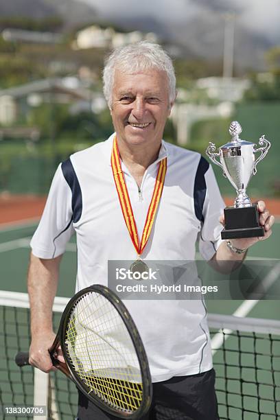 Older Man With Trophy On Tennis Court Stock Photo - Download Image Now - Trophy - Award, Senior Men, 70-79 Years