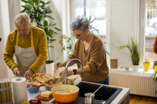 istock Modern senior Caucasian couple making homemade pizza 1383007988